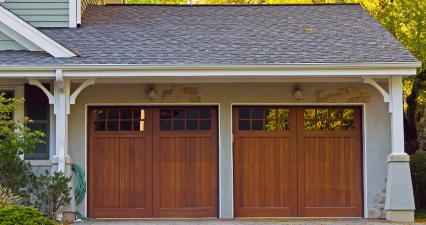 A house with a wooden garage door