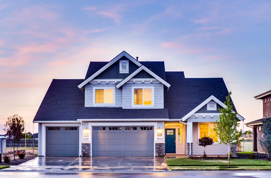 Bethany-style suburban home with double garage before severe weather
