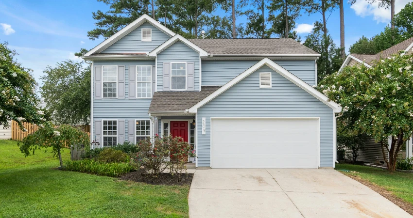 Blue house with increased security due to the newly installed garage door