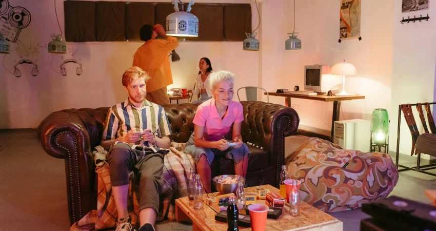 Friends in a garage converted into extra living space