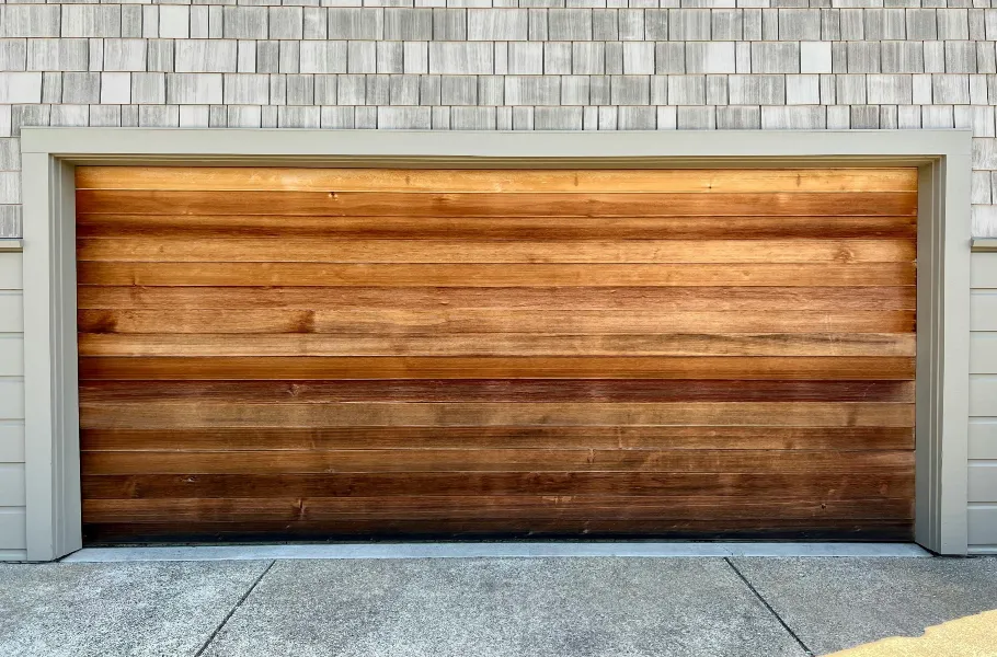 Natural wood garage door with classic wood finish