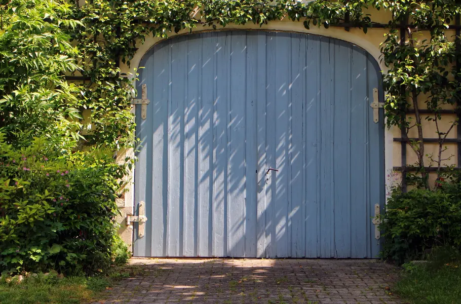 Residential garage door inspected for extreme weather preparation