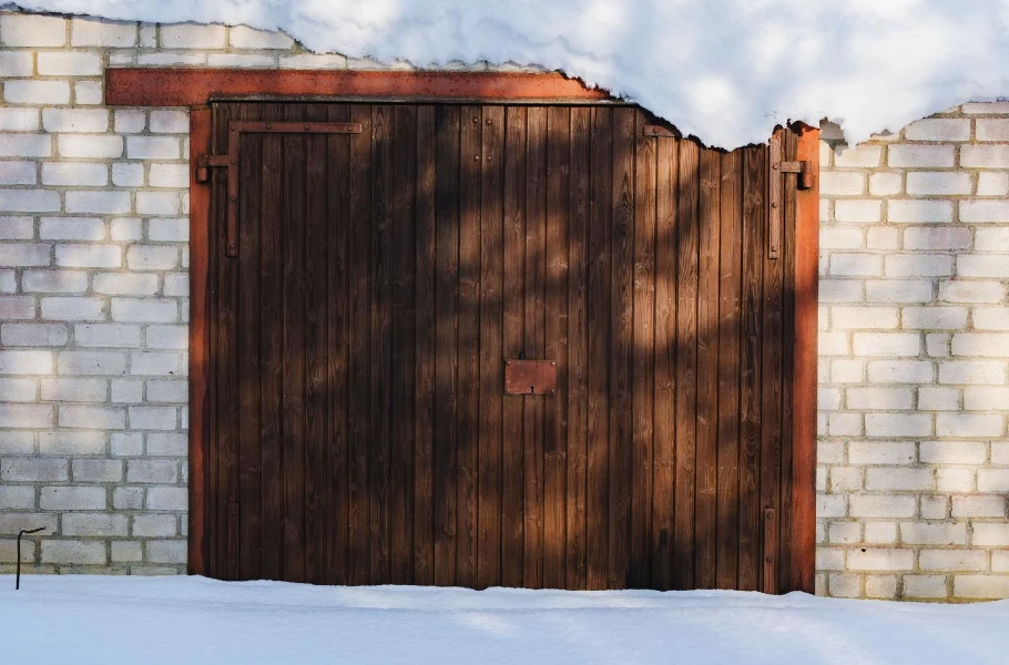Snow-covered garage door during cold winter weather