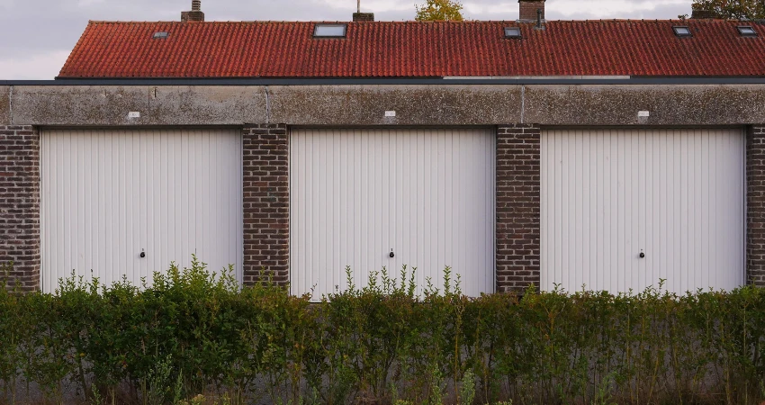 Three white garage doors