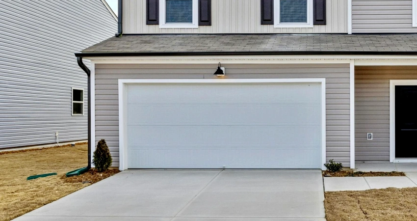 White garage door and driveway