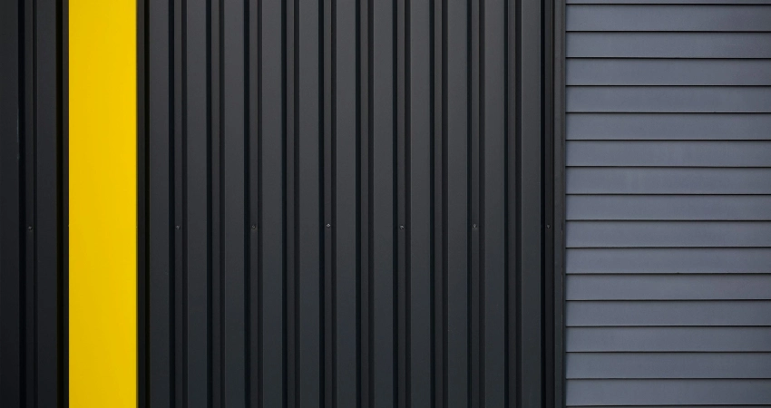 a black and yellow steel garage door with a yellow stripe for permission