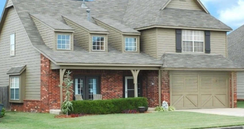 a house with wood garage door
