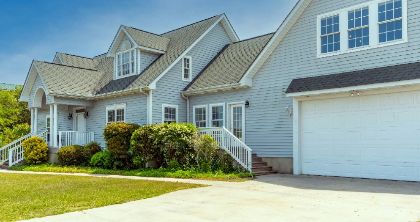 blue house with white garage door