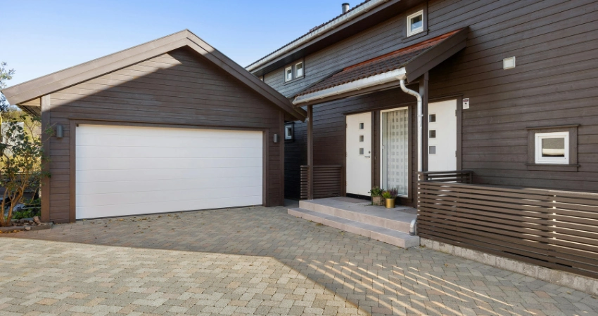 brown house with white garage door