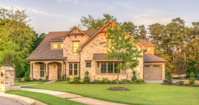 classic brick home with brown garage door