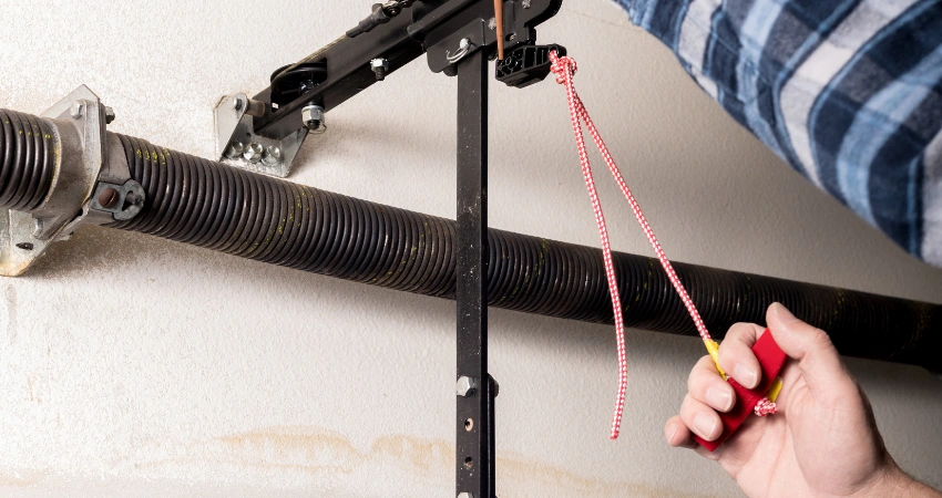 door's balance and spring tension being checked