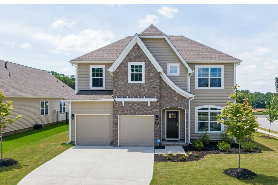 exterior of house with driveway and garage doors
