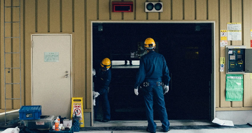 garage door professionals repairing a garage door