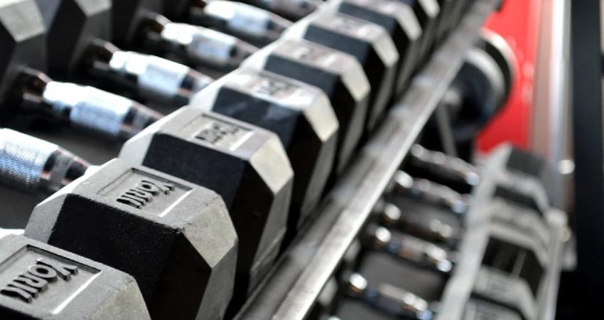 garage gym essentials like dumbbells are cheap and perfects for a garage gym