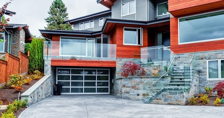 orange house featuring glass garage door