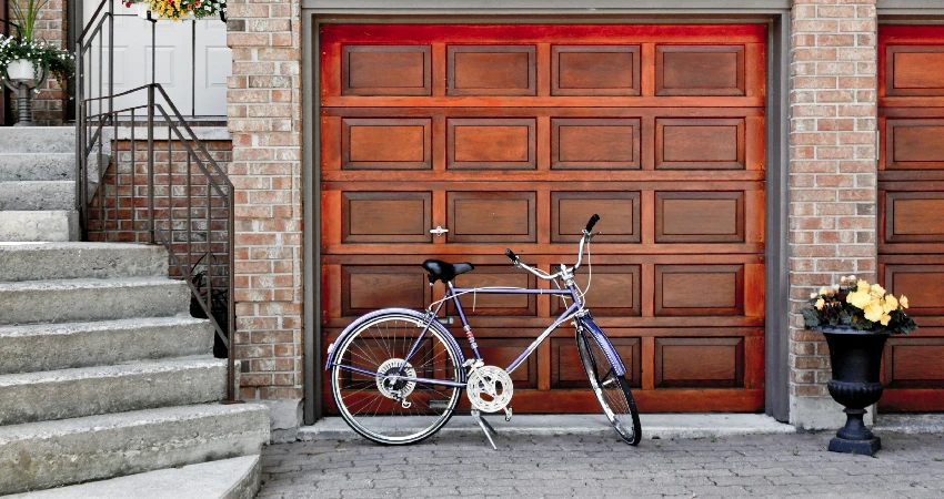 steel bicycle making contact with garage door