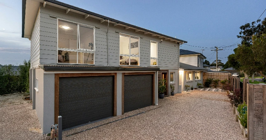 two-story home with two garage doors
