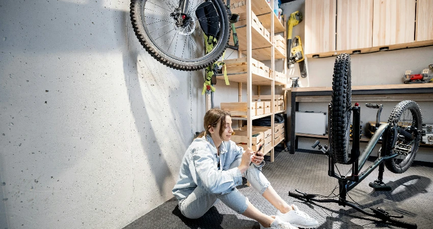 woman sitting on garage floor
